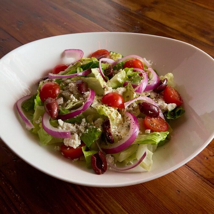 Greek salad with feta, kalamata olives, red onion, cherry tomatoes and romaine