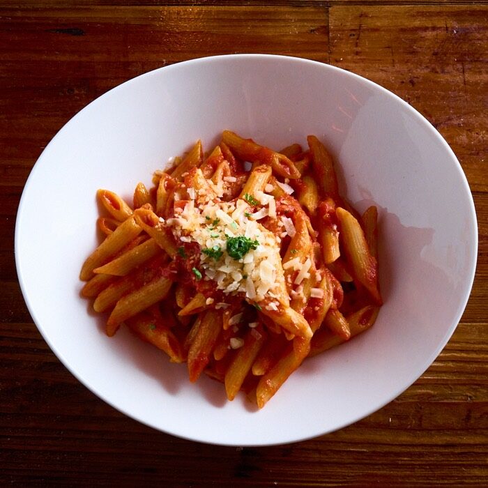 Penne arrabbiata in chili-flake garlic tomato sauce with shaved parmesan